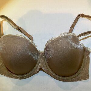 DKNY sparkly champagne bra with lace ruffles, size 32D.